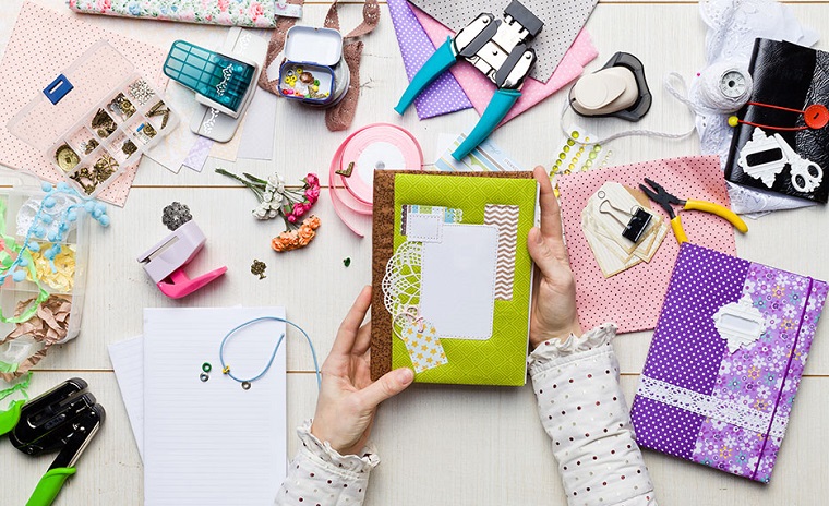 woman making a scrapbook